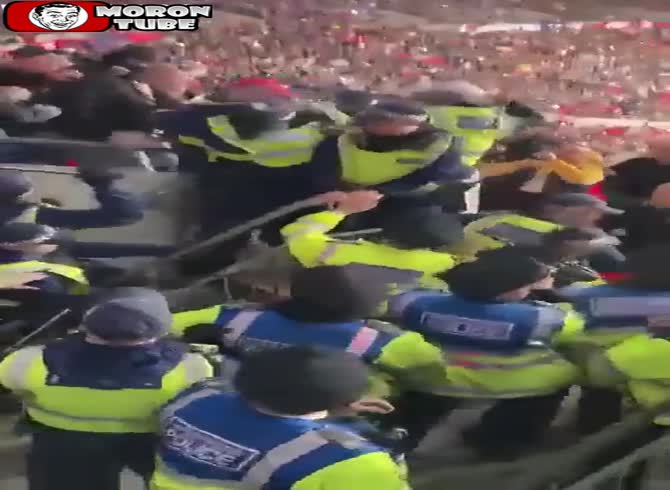 Video :Police attempt to arrest a football fan who is thought to be racist, but onlookers don't think so